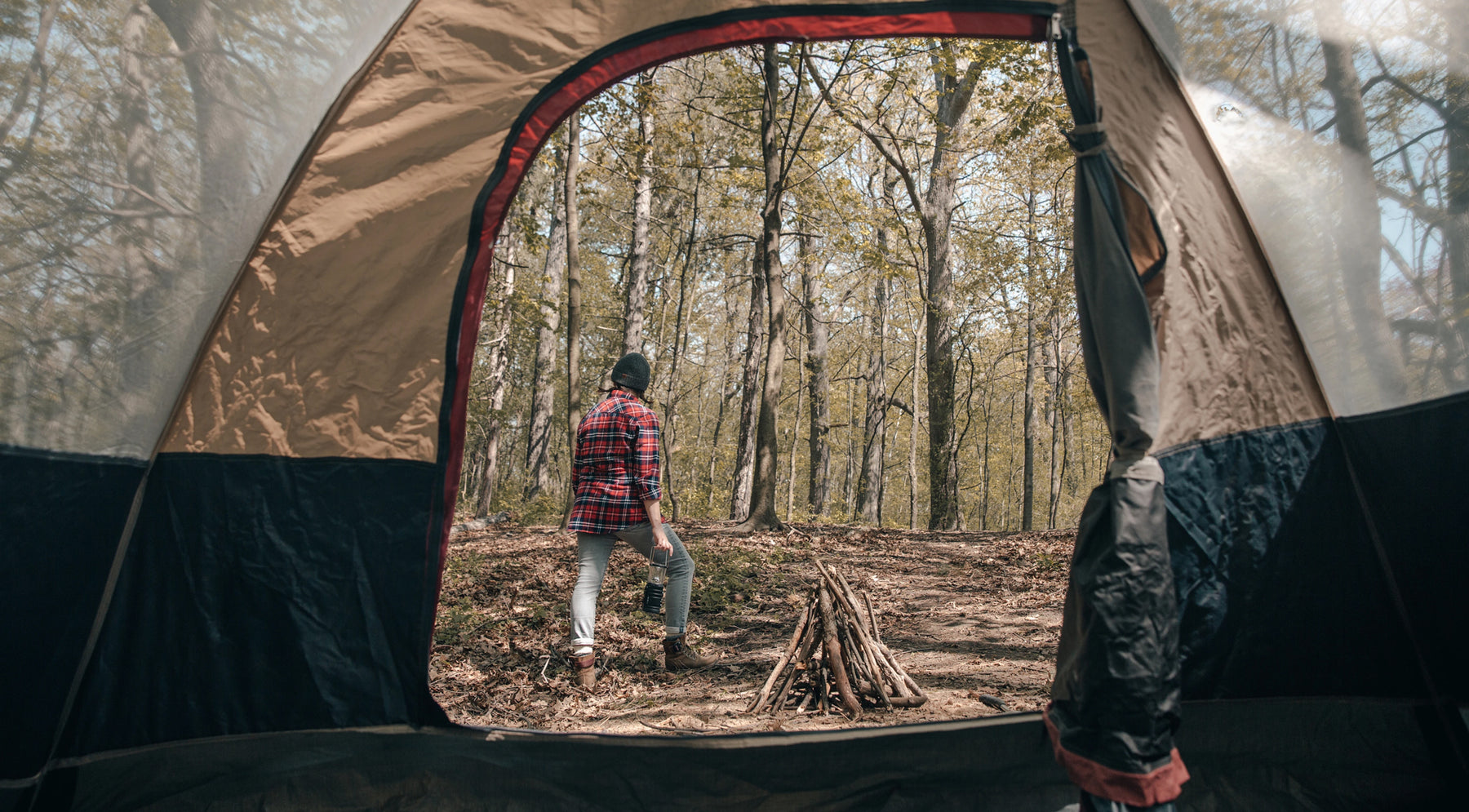 photo taken from inside a tent of a female camper.